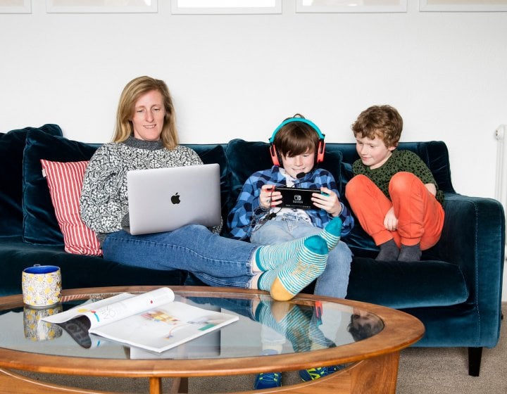 An online student working from their lounge 