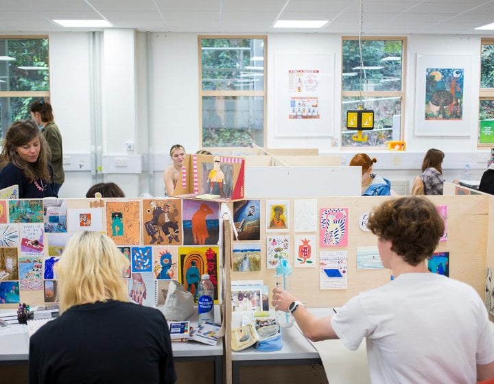 Students working in illustration studios at Falmouth University