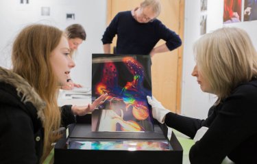 Falmouth Photography student and lecturer discussing work.
