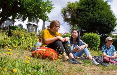 Students chatting in Woodlane Campus gardens.