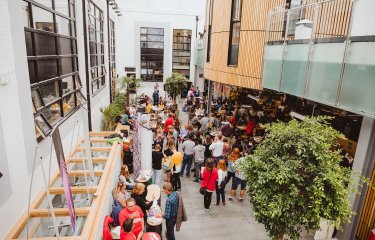 A crowd of parents and students at an Open Day inside Falmouth University's campus cafe