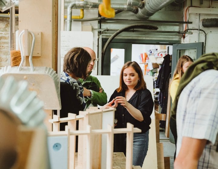 Family exploring workshop on an open day.