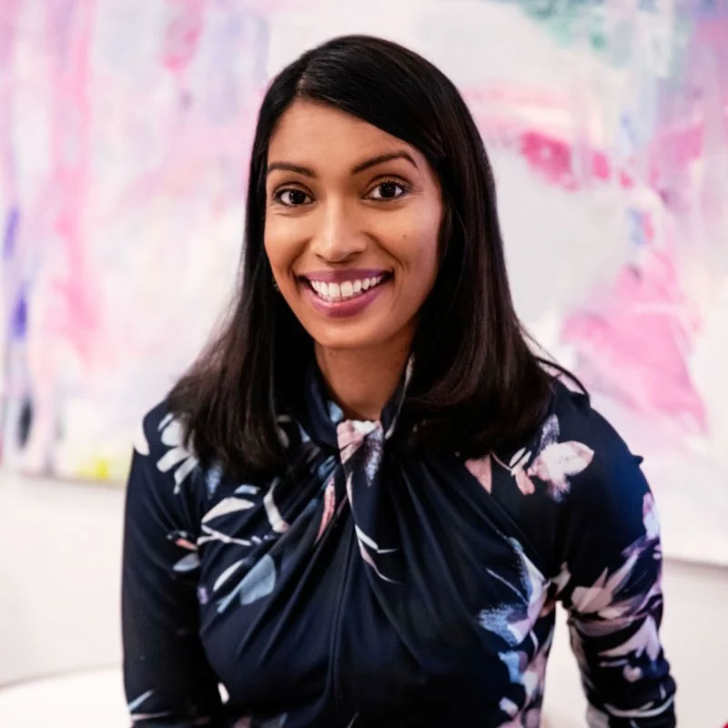 A woman smiling into the camera