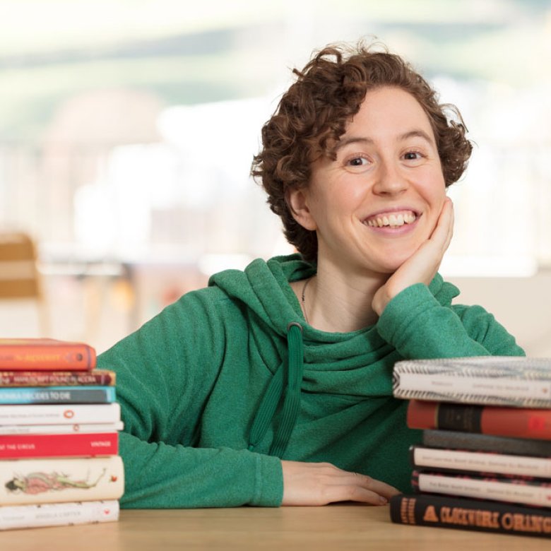 Hannah sitting with her books