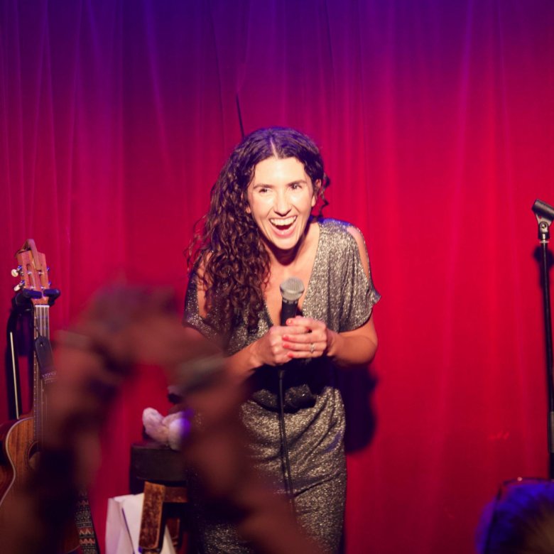 Comedy writing student Kayleigh Jones performing on stage 