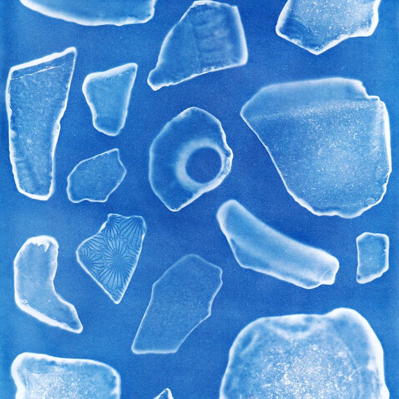 A microscopic view of unidentified fragments on a blue background