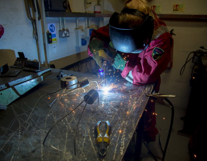 Student working in metal work studio