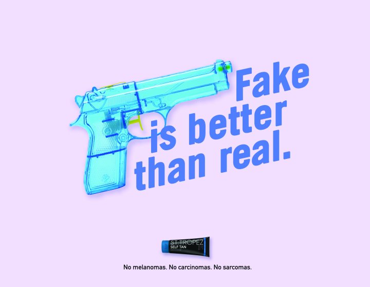 Blue toy gun with the text 'Fake is better than real'