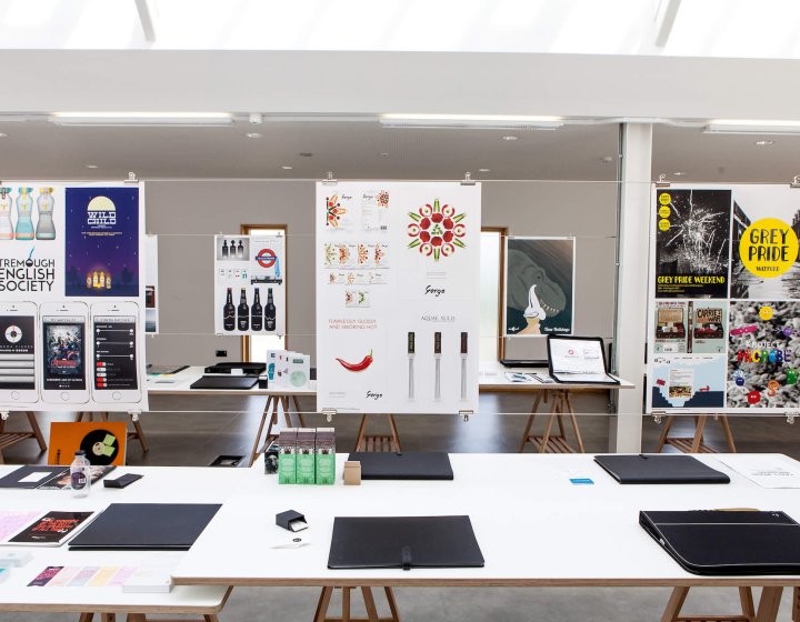 Graphic design work presentations suspended in studio at Falmouth University