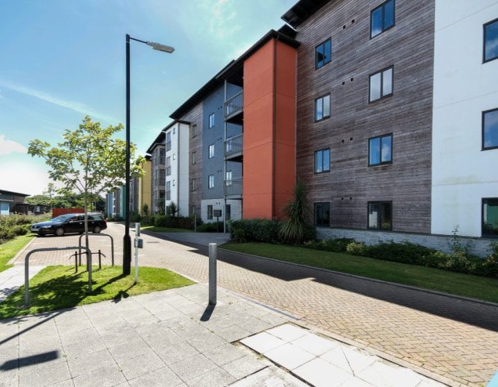 A block of student accommodation with a lamp