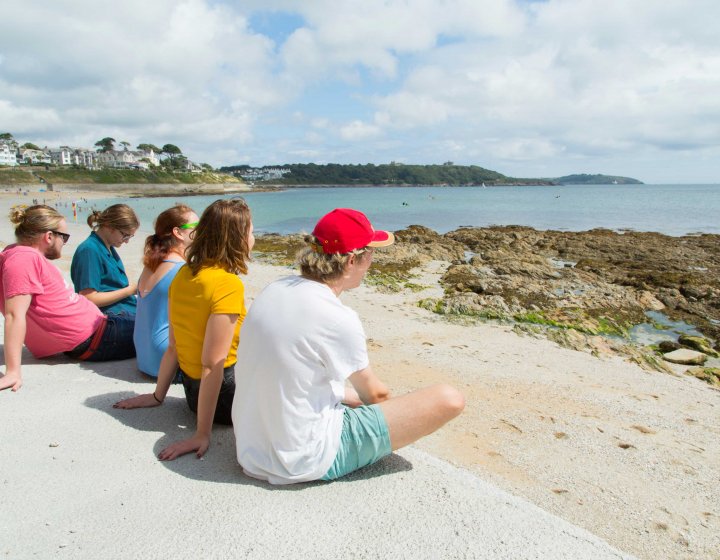 Students sat looking out to sea 