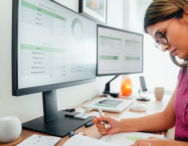 Person sat at a computer looking at data