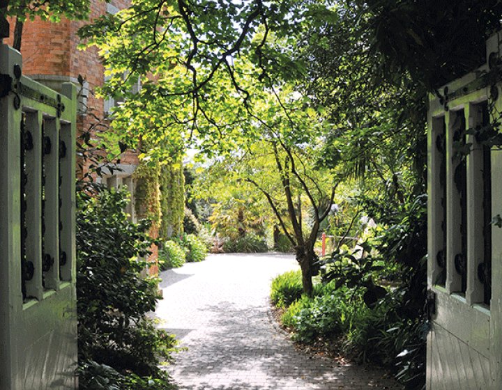 The view through the gates of the garden on Falmouth campus