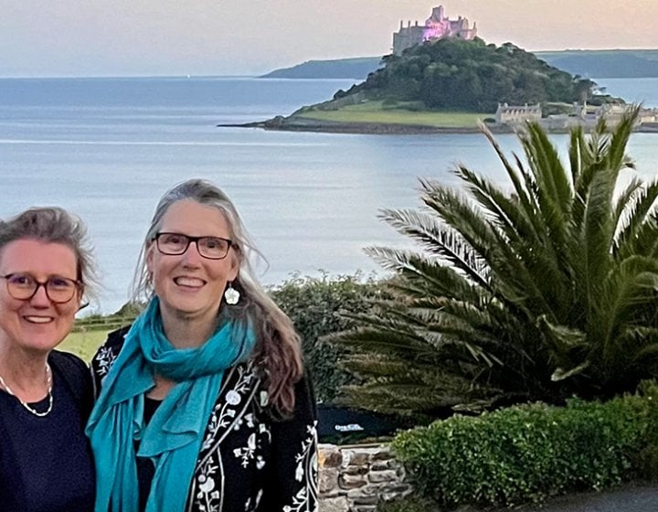 Jane Harris and Pip Wright standing beside the coast in Cornwall