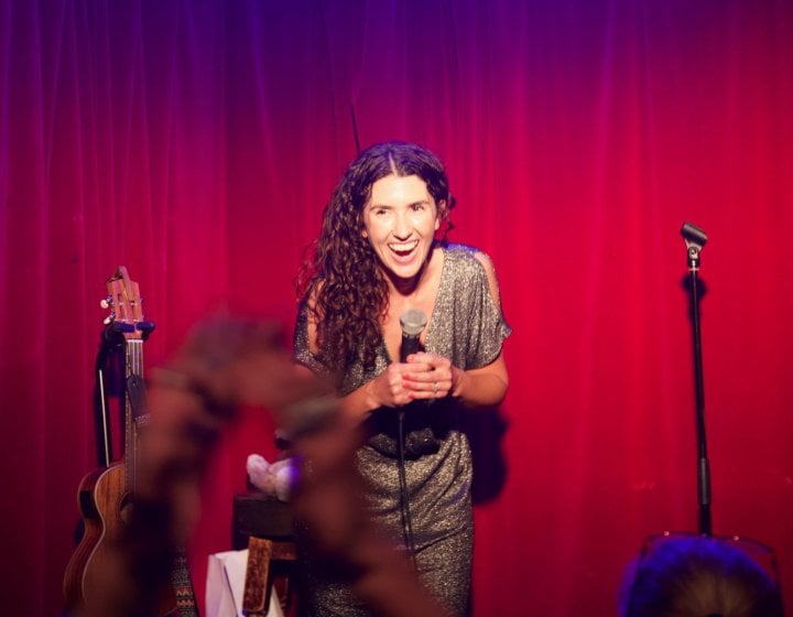 Comedy writing student Kayleigh Jones performing on stage 