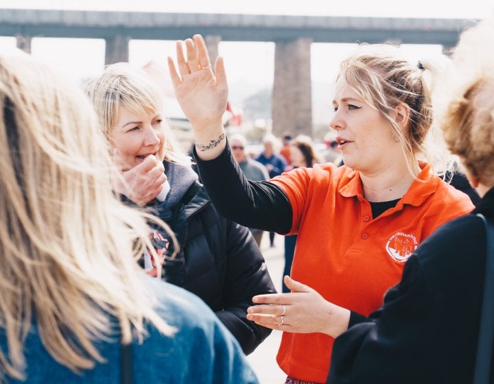 An event steward giving people directions