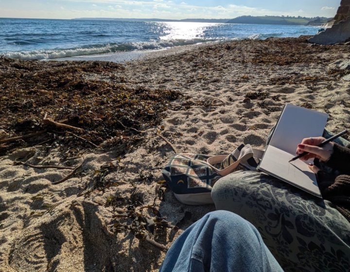 A man sat on a beach