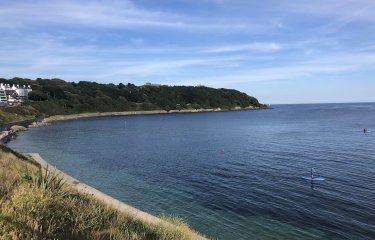 View of Castle Beach in Falmouth with Pendennis Castle in the background