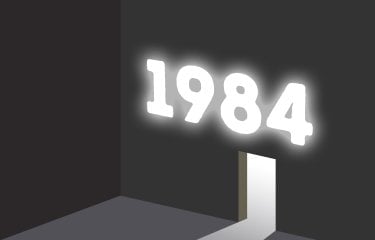 A black and white image of a wall with the white door frame in with the text '1984' above the door in glowing white light