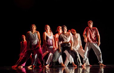 A group of young dancers performing on stage