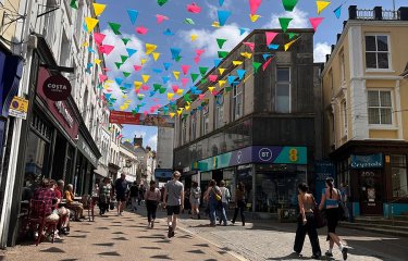 Falmouth Town high street with shops and bunting