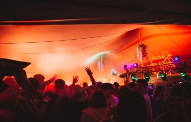 Party scene with orange lighting