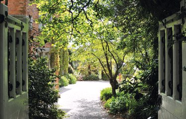 The view through the gates of the garden on Falmouth campus