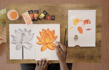 An open sketchbook with flower drawings