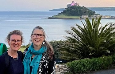 Jane Harris and Pip Wright standing beside the coast in Cornwall