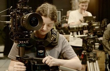 A female student operating an ARRI camera at Falmouth University