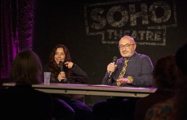 Two people sat at a table