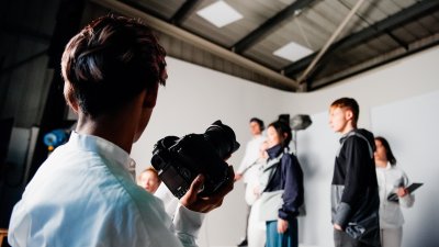 Studio shoot with a man holding a camera