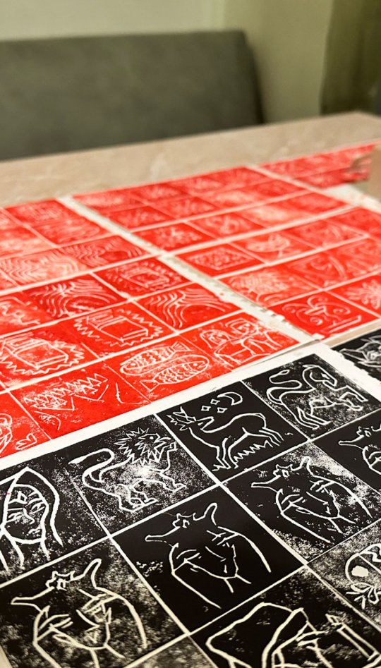 Lino prints in red and black