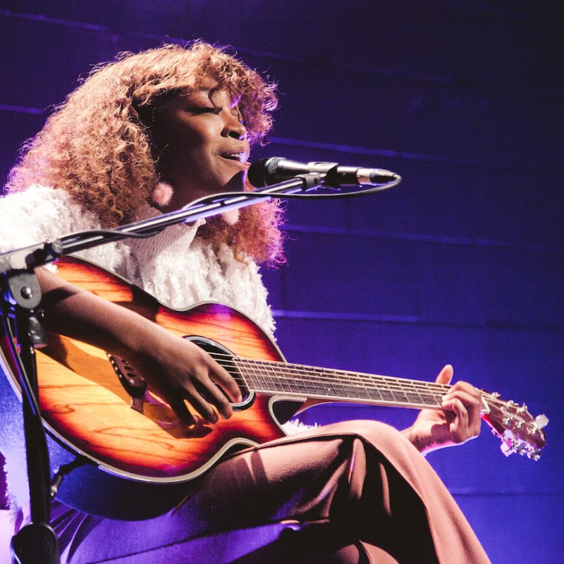 Monette Allison playing guitar