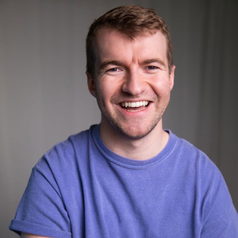 A headshot image of performer Sam Cochrane