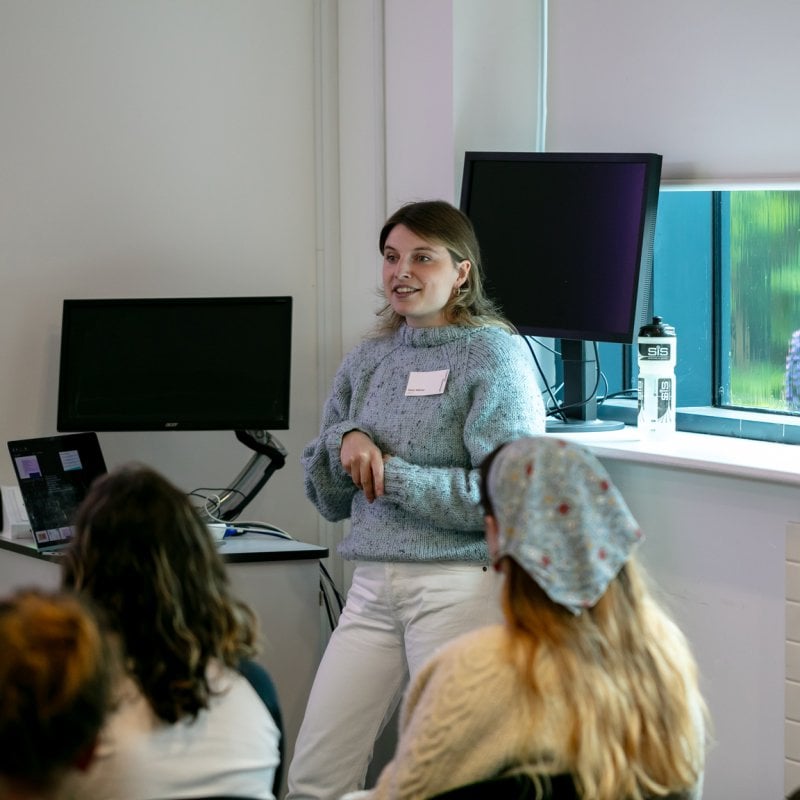 A woman giving a presentation