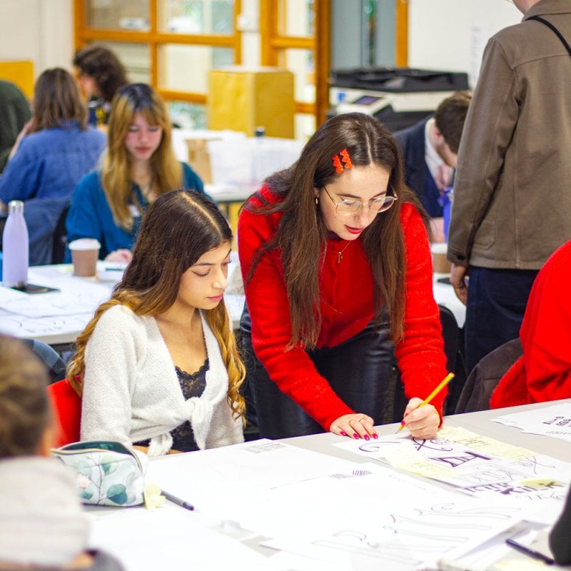 Maria offering advice to a student