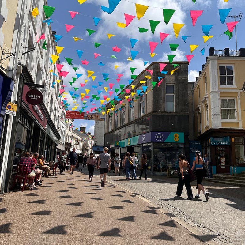 Falmouth Town high street with shops and bunting