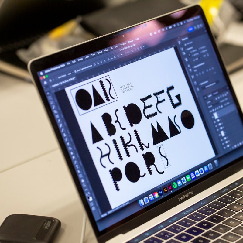 Laptop screen with typography designs