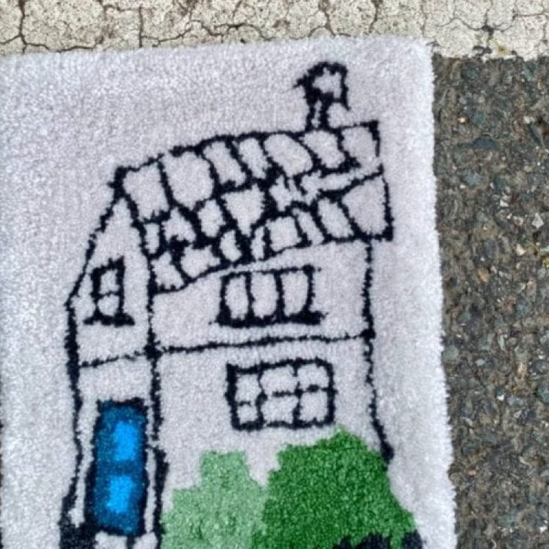 A felted picture of a house