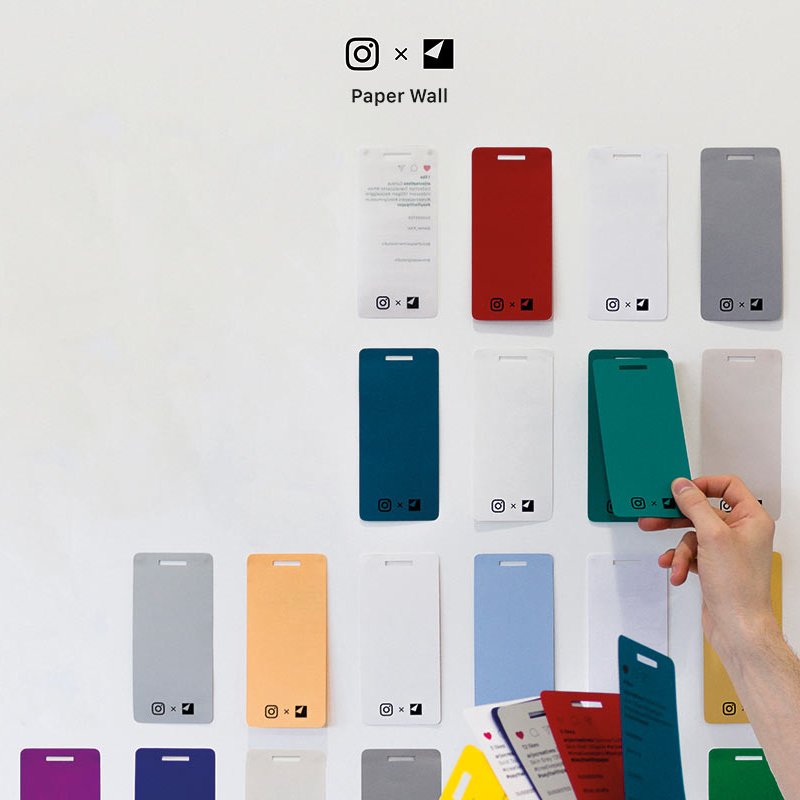 Wall of phone shaped coloured pieces of paper