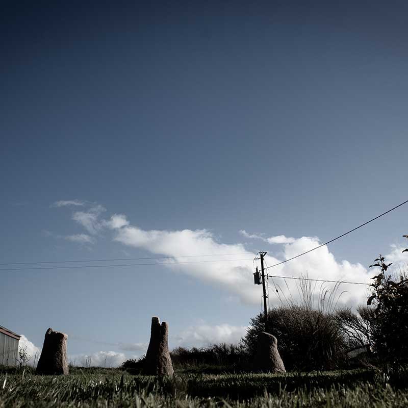 Some stone sculptures in a field 