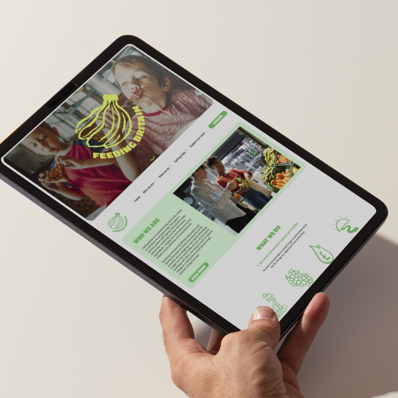 An iPad with a website design on the screen