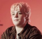 Headshot of a Photography BA Online student with blonde cropped hair