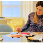 A woman working at a dinner table