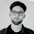 Black and white photograph of a male Falmouth University student