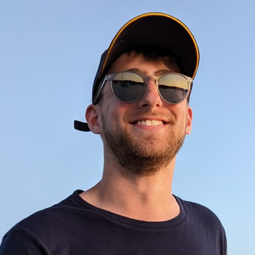 Man (Falmouth University graduate James Pearce) wearing black tshirt, sunglasses and cap